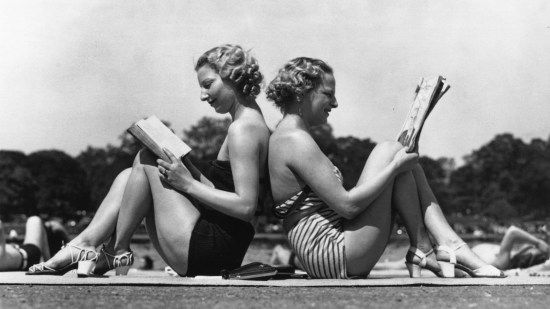 girls reading beach