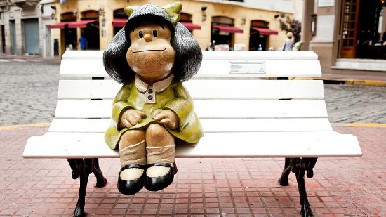 71059565-Mafalda-Famous-6-Year-Old-Cartoon-Character-Sitting-On-A-Bench-In-Defensa-San-Telmo-Buenos-Aires-Argentina
