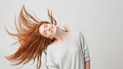 portrait-young-cheerful-beautiful-redhead-girl-smiling-with-closed-eyes-shaking-head-hair